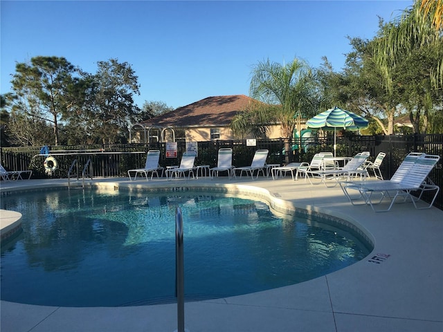 view of swimming pool featuring a patio area