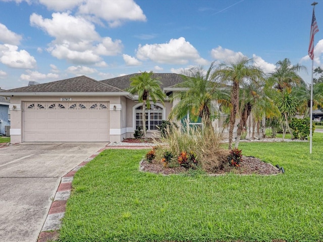 view of front of house with a front lawn and a garage