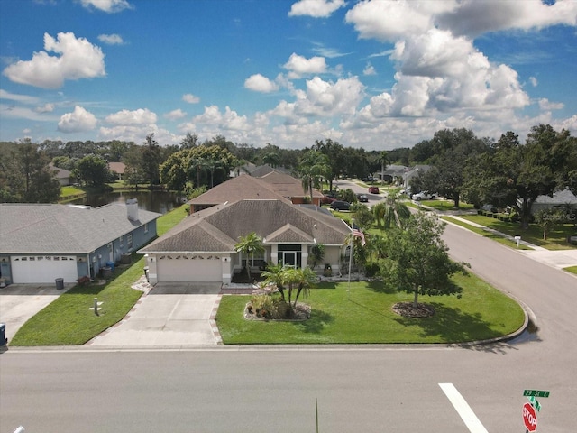 view of front facade with a front yard and a garage