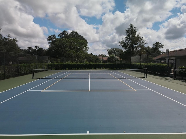 view of sport court featuring basketball hoop