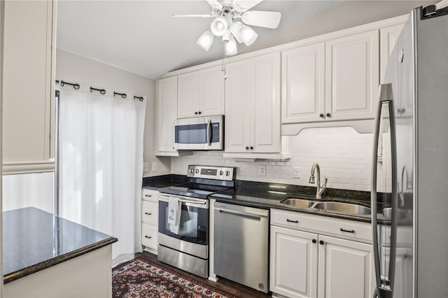 kitchen with white cabinetry, sink, ceiling fan, and stainless steel appliances