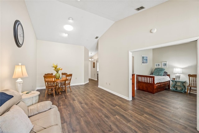 living room with lofted ceiling and dark hardwood / wood-style floors