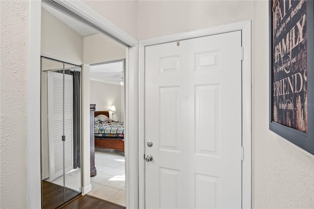 hall with hardwood / wood-style flooring and vaulted ceiling