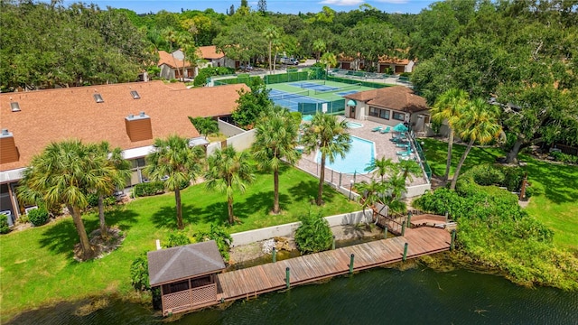 birds eye view of property with a water view