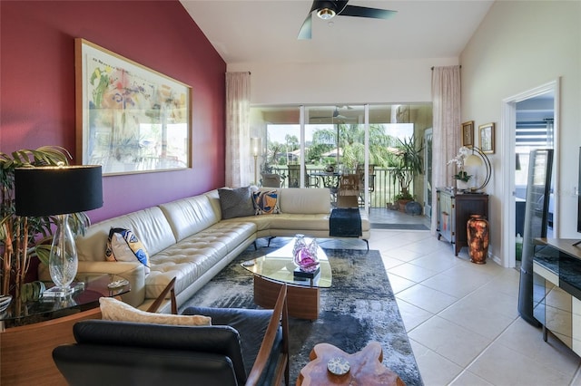 tiled living room with ceiling fan and lofted ceiling