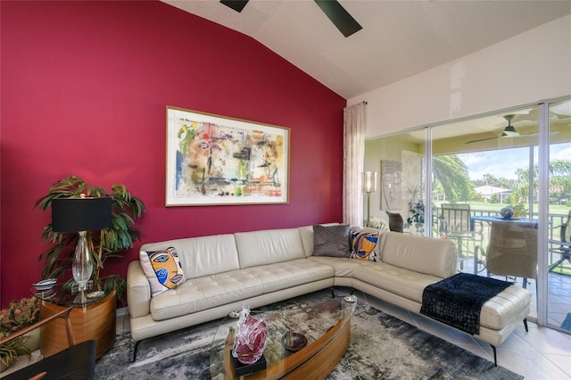 living room with lofted ceiling, ceiling fan, and tile patterned floors