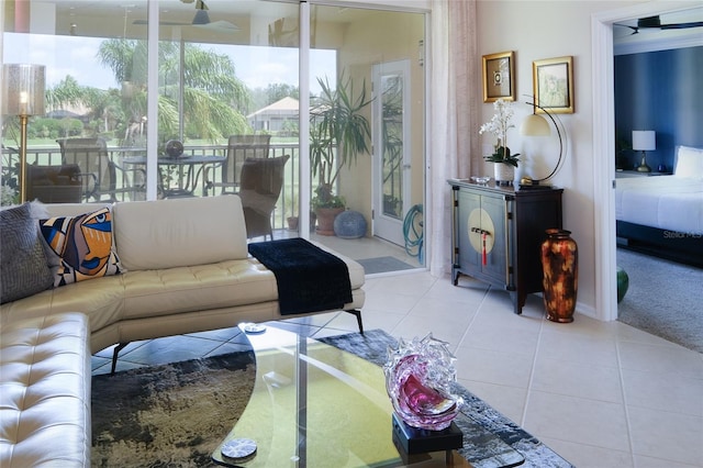 tiled living room with ceiling fan