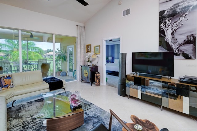 tiled living room featuring ceiling fan and lofted ceiling