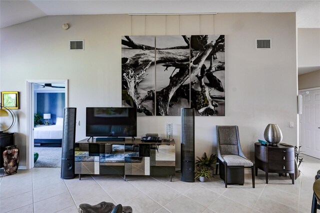 tiled living room with lofted ceiling