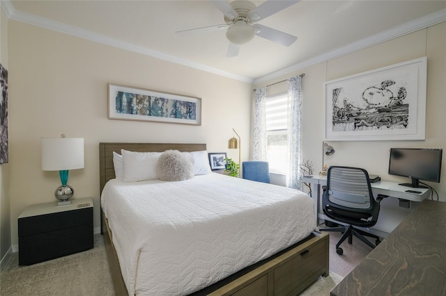 carpeted bedroom with ceiling fan and ornamental molding