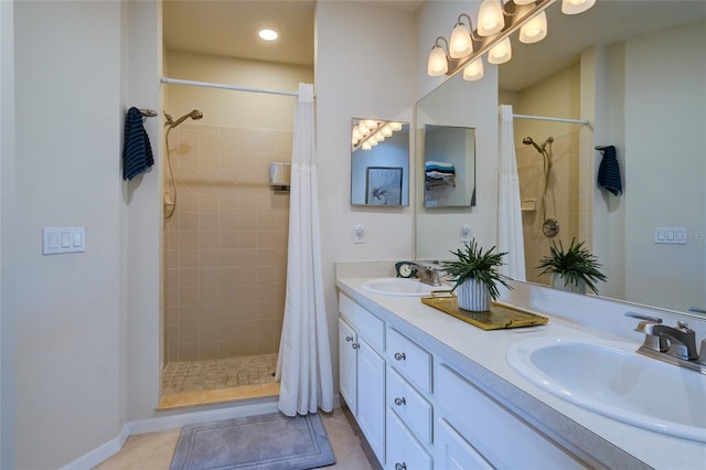 bathroom featuring a shower with shower curtain, tile patterned floors, and vanity