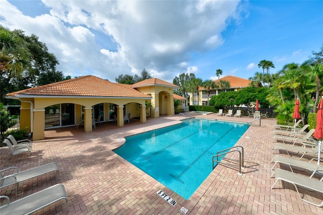 view of swimming pool featuring a patio area