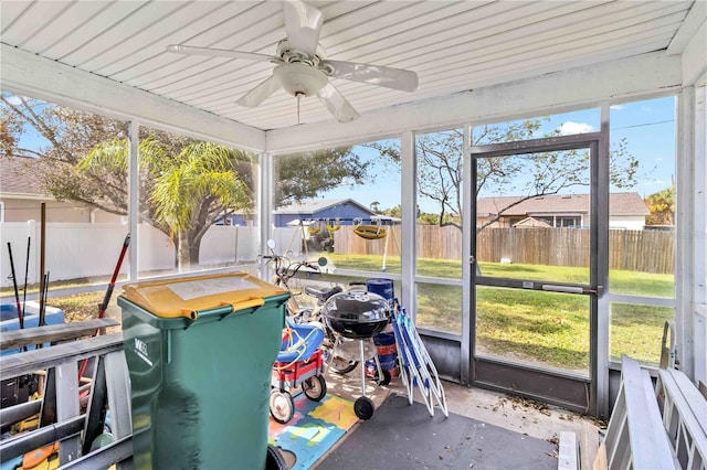 sunroom featuring ceiling fan