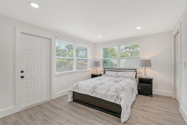 bedroom with light hardwood / wood-style flooring