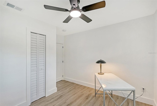 office area with ceiling fan and light hardwood / wood-style flooring