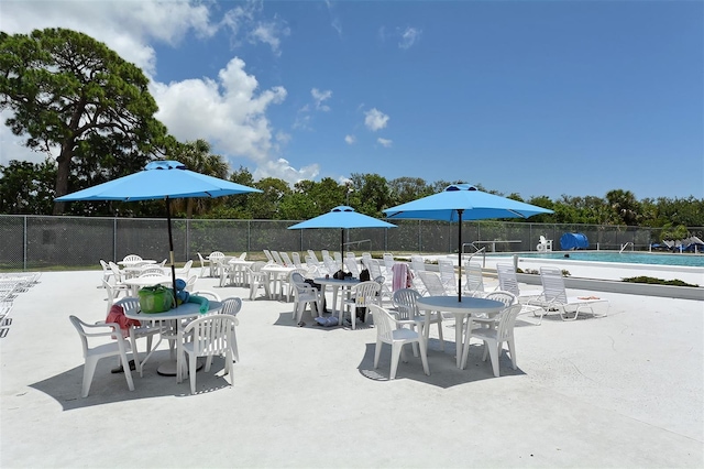 view of patio / terrace featuring a community pool