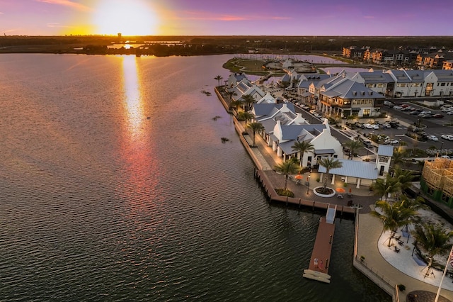 aerial view at dusk with a water view