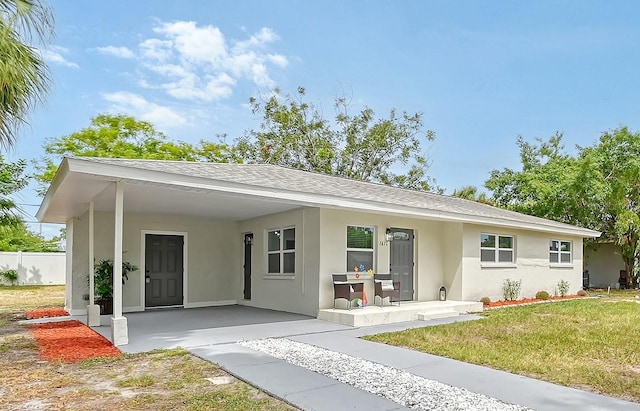 view of front of house with a front lawn and covered porch