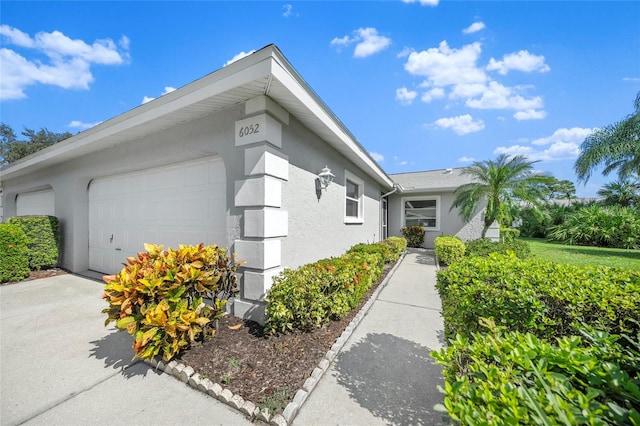 view of property exterior featuring a garage