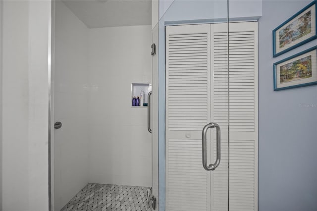 bathroom featuring an enclosed shower