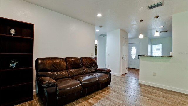 823 32nd Ave E, Bradenton, FL 34208 - living area with baseboards, wood finished floors, and recessed lighting