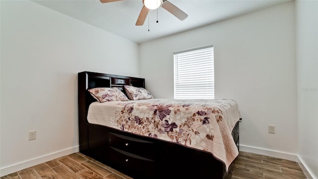 bedroom featuring ceiling fan and hardwood / wood-style flooring