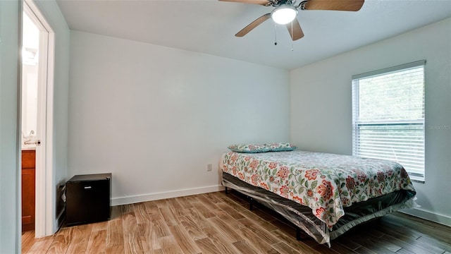 bedroom with ceiling fan and hardwood / wood-style flooring