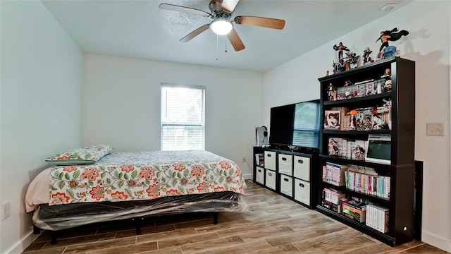 823 32nd Ave E, Bradenton, FL 34208 - bedroom with wood finished floors, baseboards, and a ceiling fan