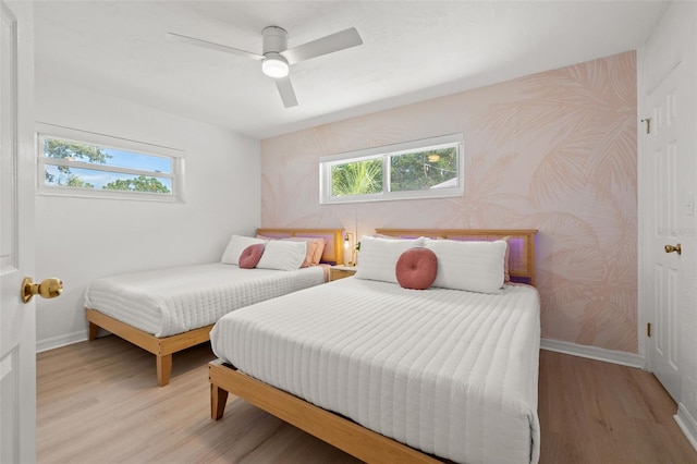 bedroom featuring light wood-type flooring and ceiling fan