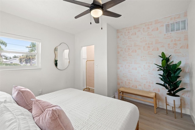 bedroom with wood-type flooring and ceiling fan