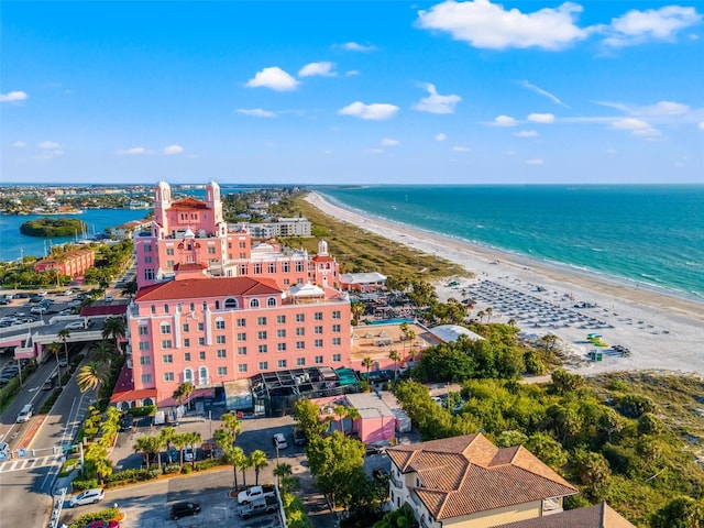 bird's eye view featuring a water view and a beach view