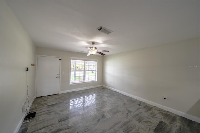 empty room featuring ceiling fan