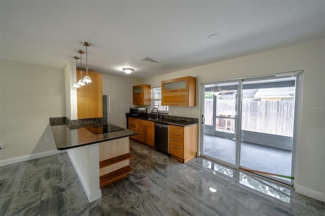 kitchen featuring pendant lighting, dark stone counters, kitchen peninsula, a kitchen bar, and stainless steel appliances