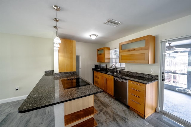 kitchen featuring hanging light fixtures, black electric stovetop, kitchen peninsula, dishwasher, and dark stone counters