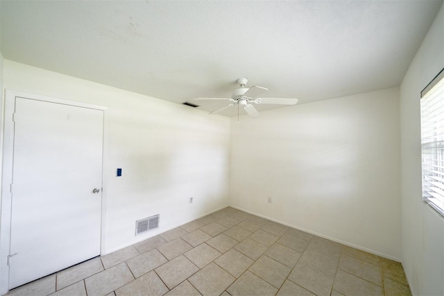 unfurnished room with ceiling fan