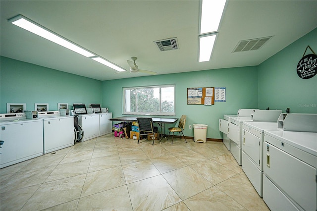 laundry area with ceiling fan and washer and dryer