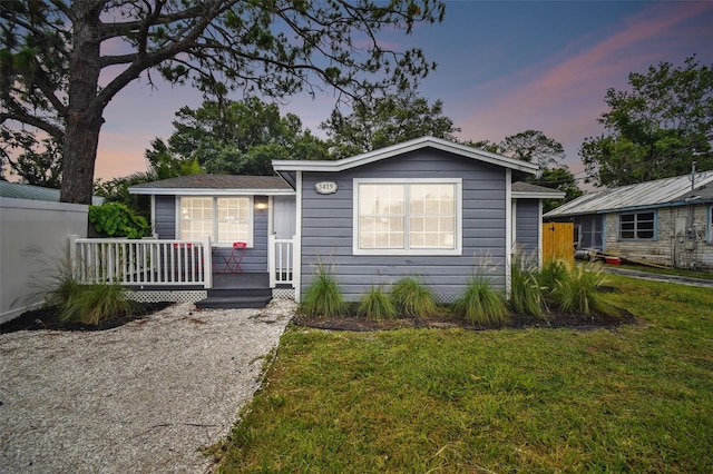 3419 19th St E, Bradenton, FL 34208 - view of front facade with a lawn and a deck