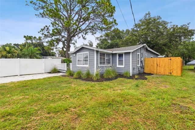 3419 19th St E, Bradenton, FL 34208 - exterior space with a lawn and fence
