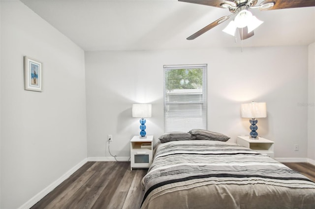 bedroom featuring dark hardwood / wood-style floors and ceiling fan