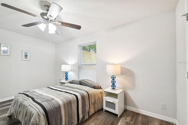 bedroom featuring ceiling fan and dark hardwood / wood-style floors