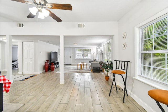 interior space with ceiling fan and light hardwood / wood-style floors