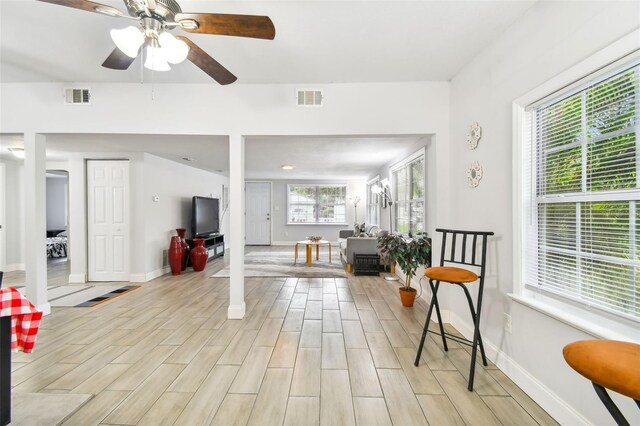 3419 19th St E, Bradenton, FL 34208 - interior space with light wood-type flooring, visible vents, a ceiling fan, and baseboards