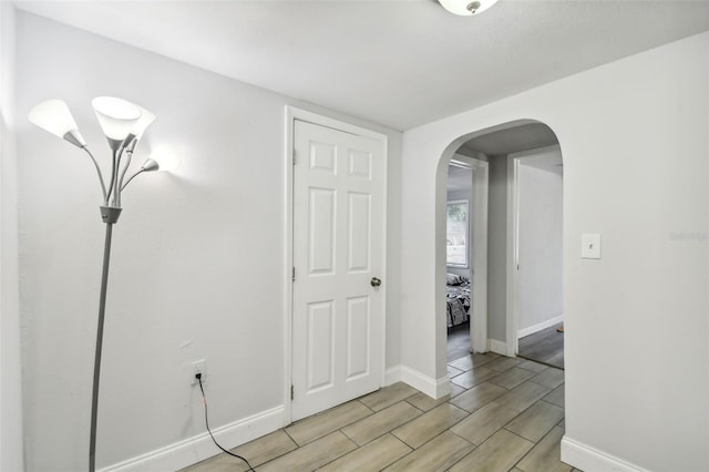 3419 19th St E, Bradenton, FL 34208 - interior space with baseboards, wood finish floors, and arched walkways