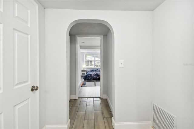 hall with light wood-type flooring