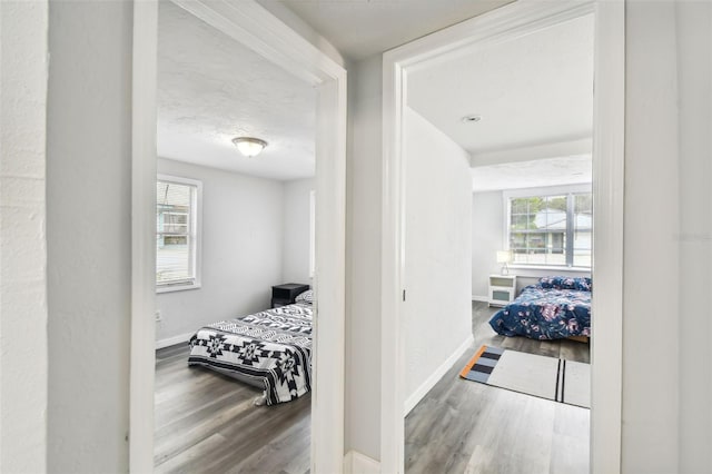 hall with hardwood / wood-style floors