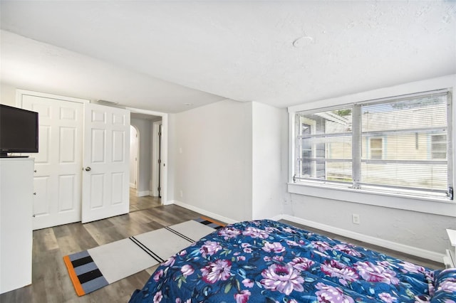 3419 19th St E, Bradenton, FL 34208 - bedroom featuring wood finished floors, visible vents, and baseboards
