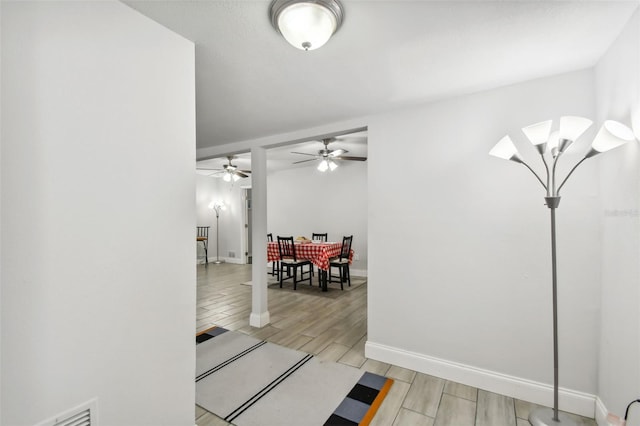 hallway with light hardwood / wood-style floors