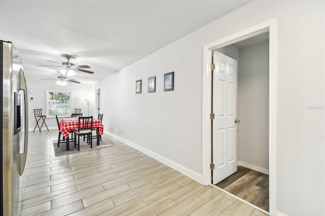 dining area featuring light hardwood / wood-style floors and ceiling fan