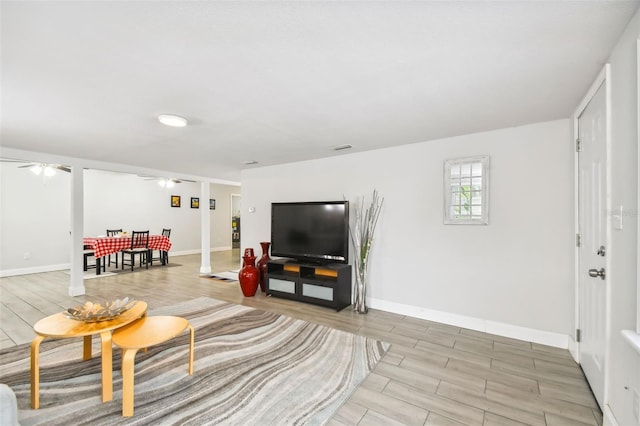 3419 19th St E, Bradenton, FL 34208 - living room featuring visible vents, baseboards, wood finish floors, and ceiling fan