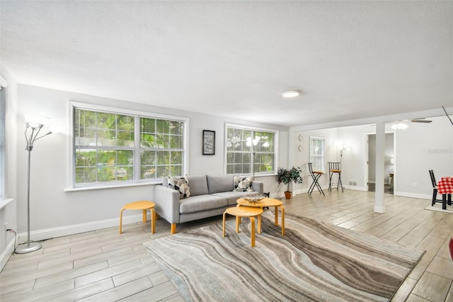 3419 19th St E, Bradenton, FL 34208 - living room with wood finish floors, baseboards, and ceiling fan